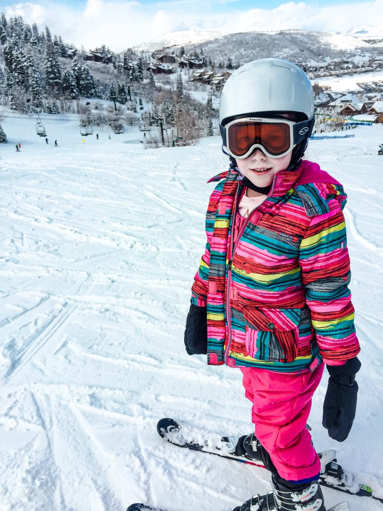 little baby girl bundled up for skiing