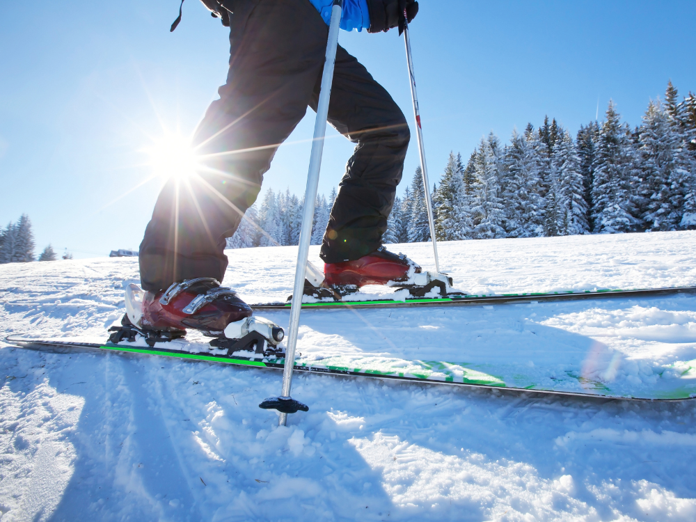 a man with skis on is about to go for a fun ride down the mountain