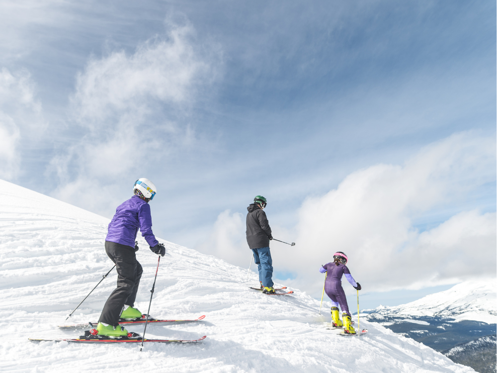 family having a fun ski day with lots of snow.