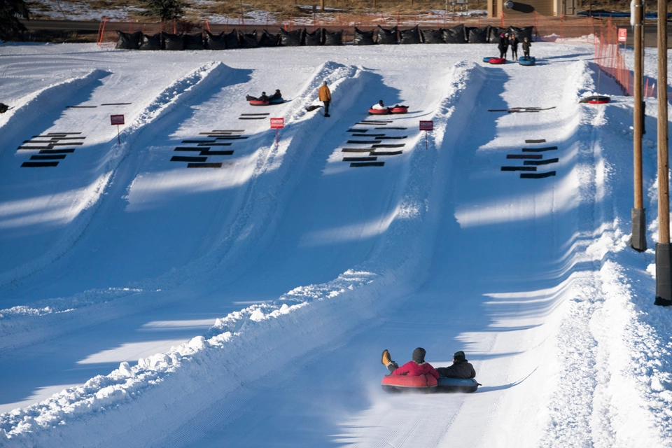 kids tubing down the hills.