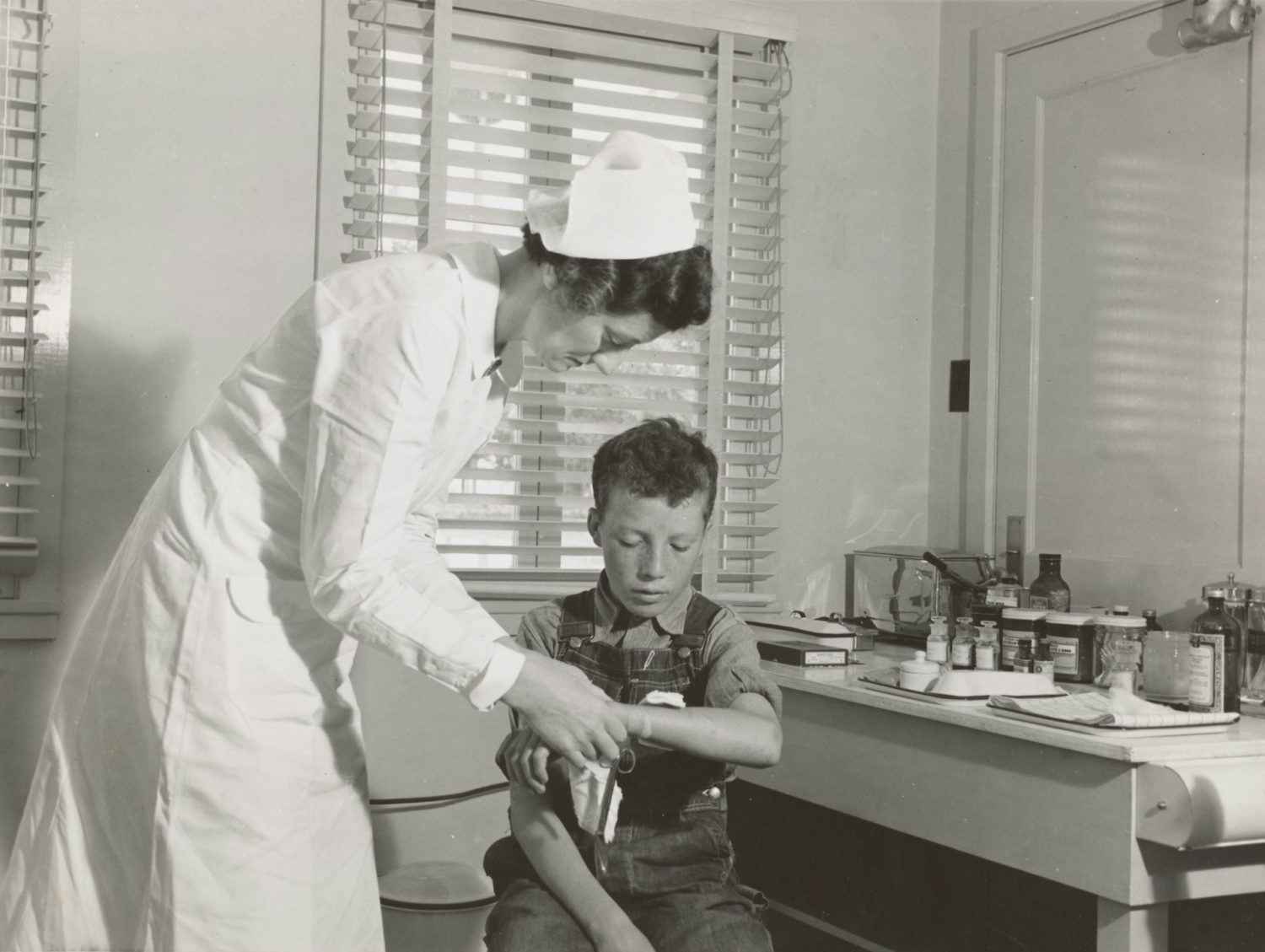 Nurse tending to young boy. Haunted Hotels New Orleans.