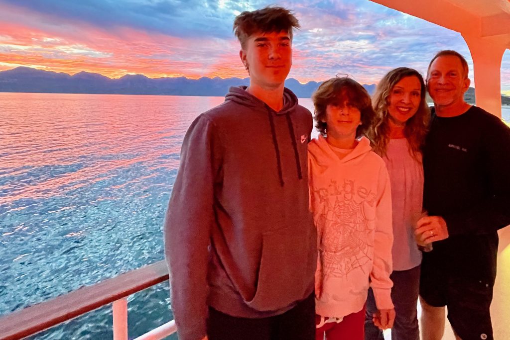 family during sunset on cruise to Baja Mexico