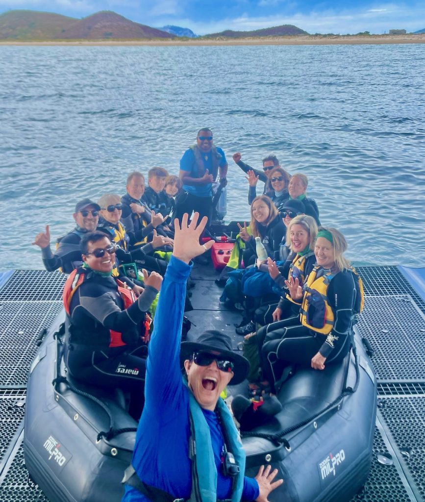 passengers aboard a skiff on a cruise to Baja Mexcio