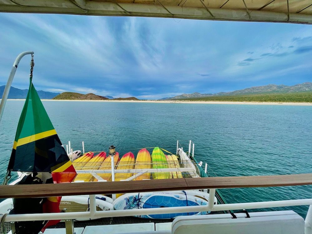 kayaks and SUPs attached to back of boat on cruise to Baja Mexico