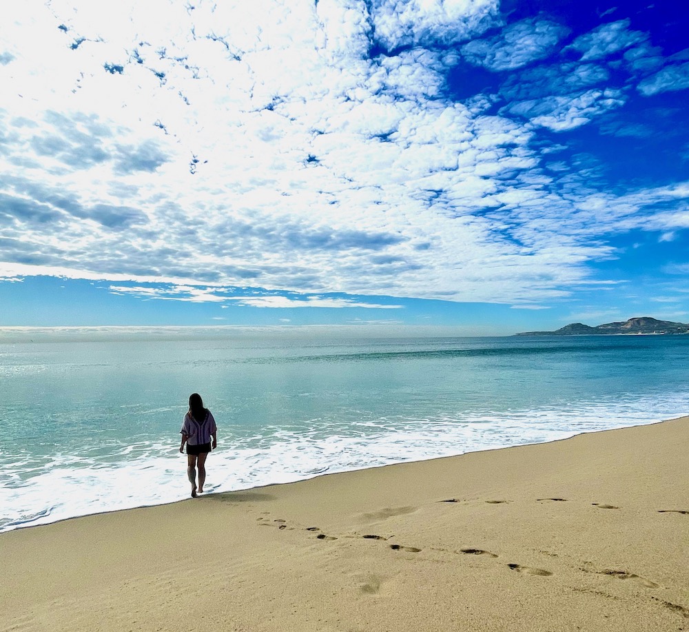 girls walking to ocean from sand on cruise to Baja Mexico