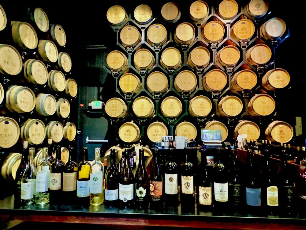 bottles of wine in a barrel room