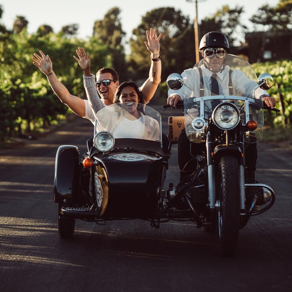 man and woman in a side car in temecula Wine Country