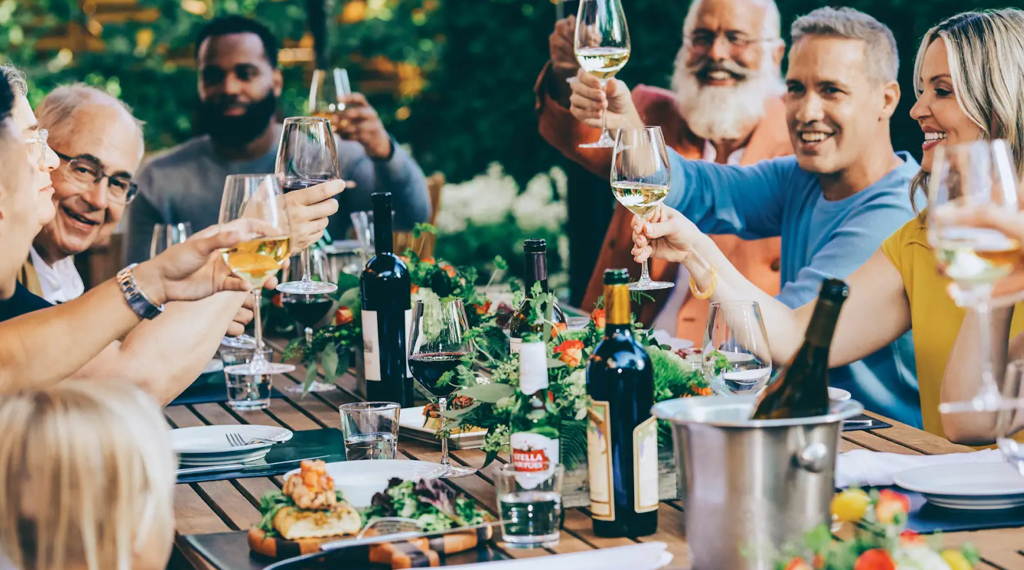 people toasting at dinner table