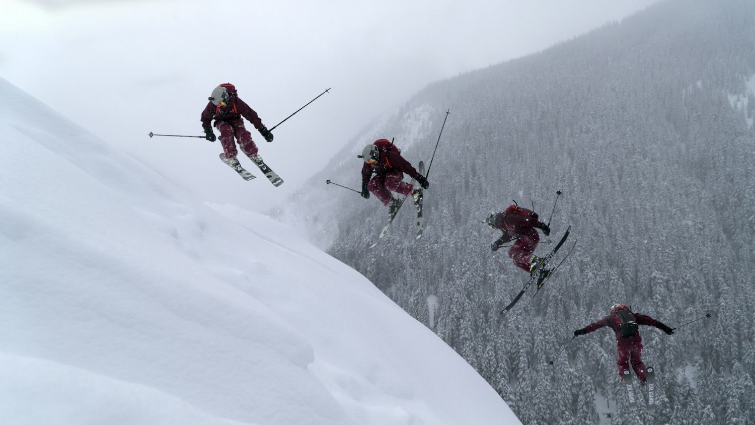 Four men jumping on ski slopes. Colorado ski towns.