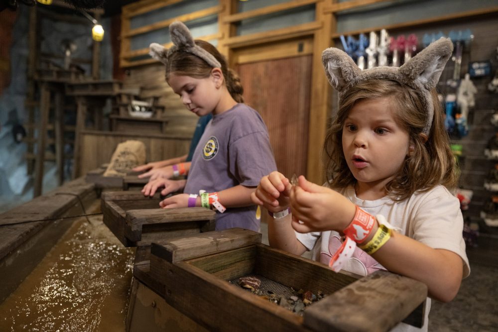 Two girls mining for gold at Great Wolf Lodge