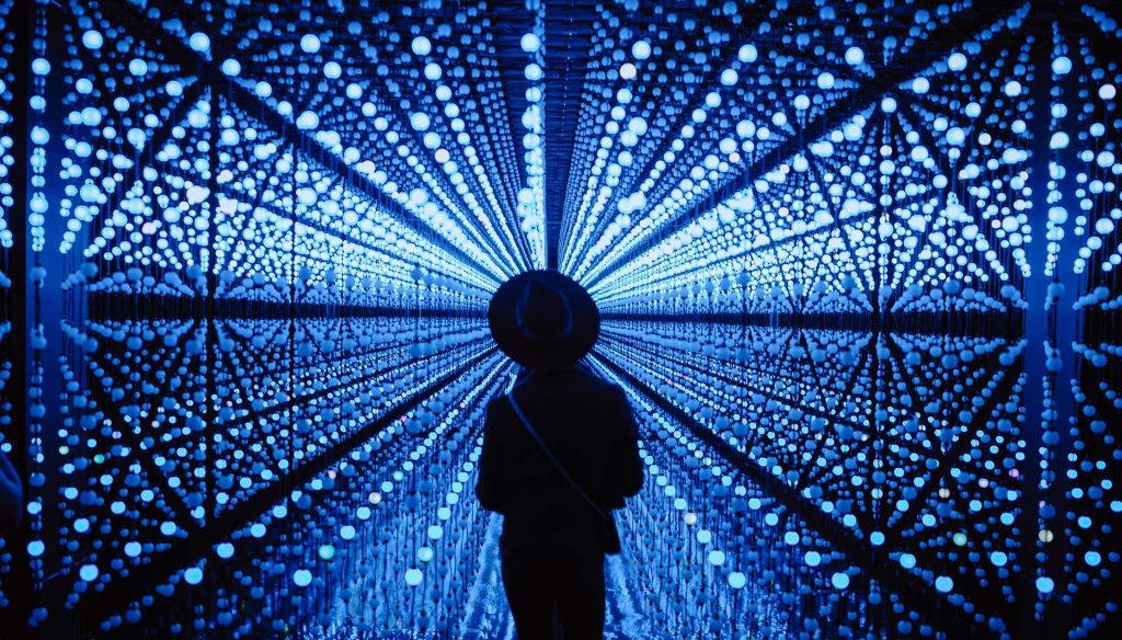 Woman at Hopscotch in San Antonio enjoying the immersive art. 