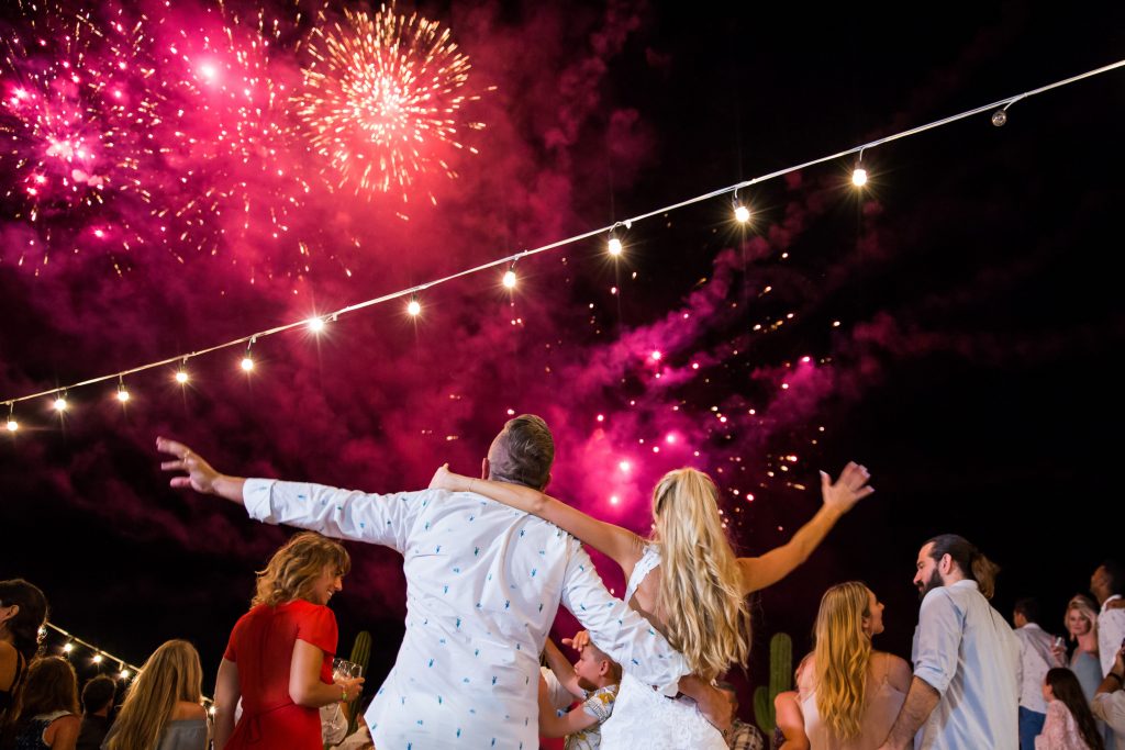 people dancing to fireworks at holidays