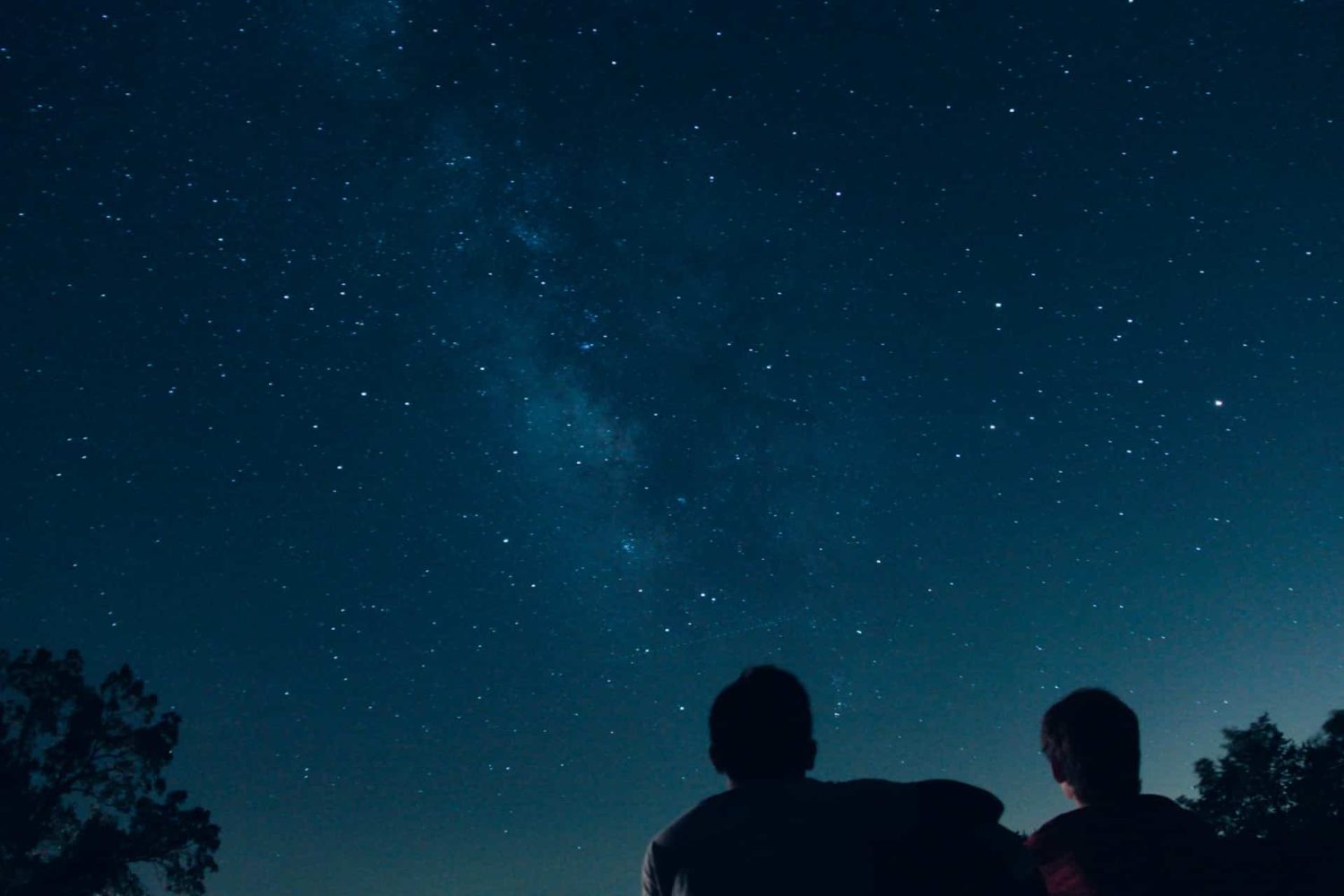 Two people gazing up at the stars. Hocking Hills romantic getaways.