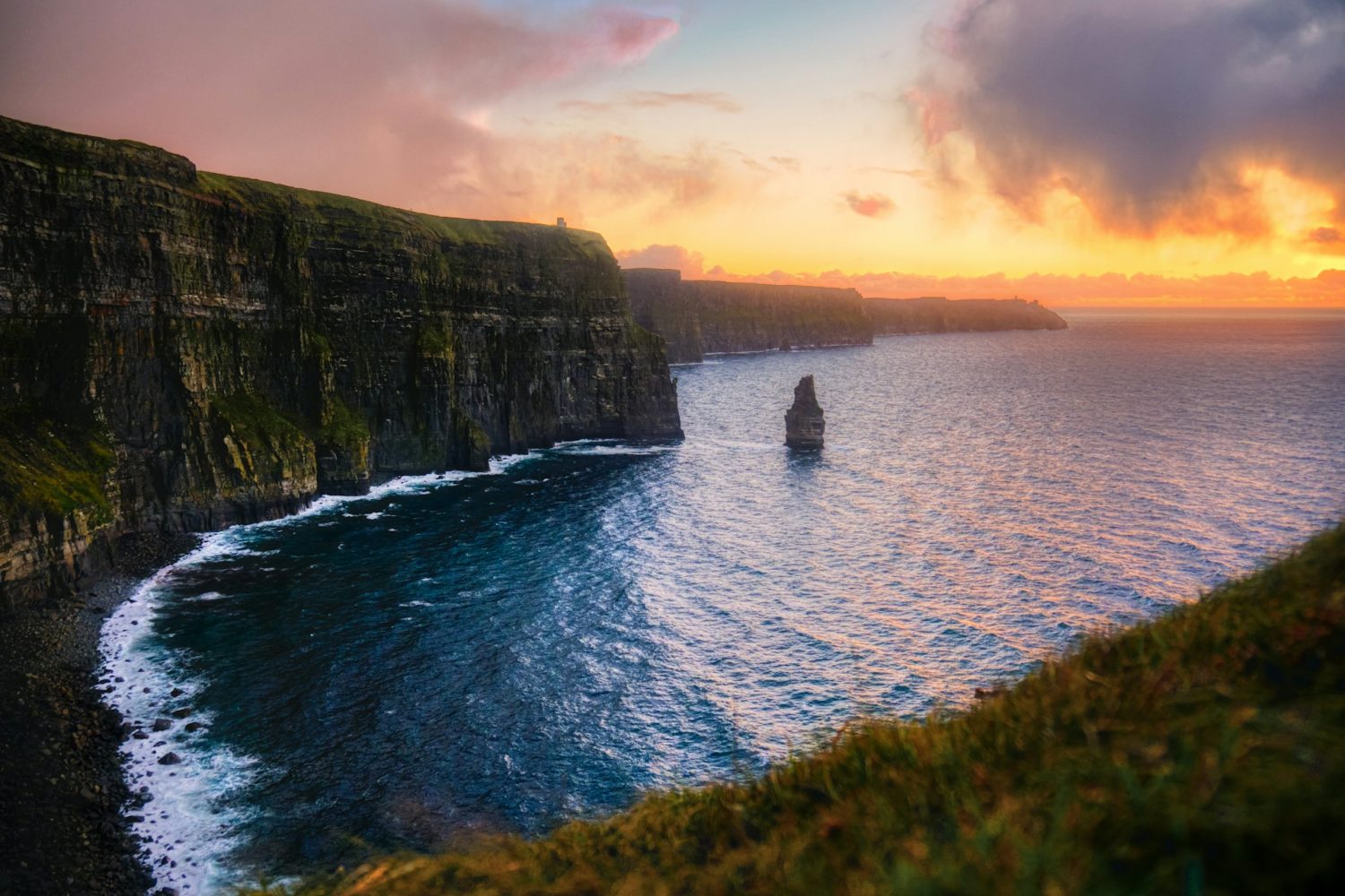 Cliffs of Moher in Ireland during the sunset. Best places to visit in May in Europe.
