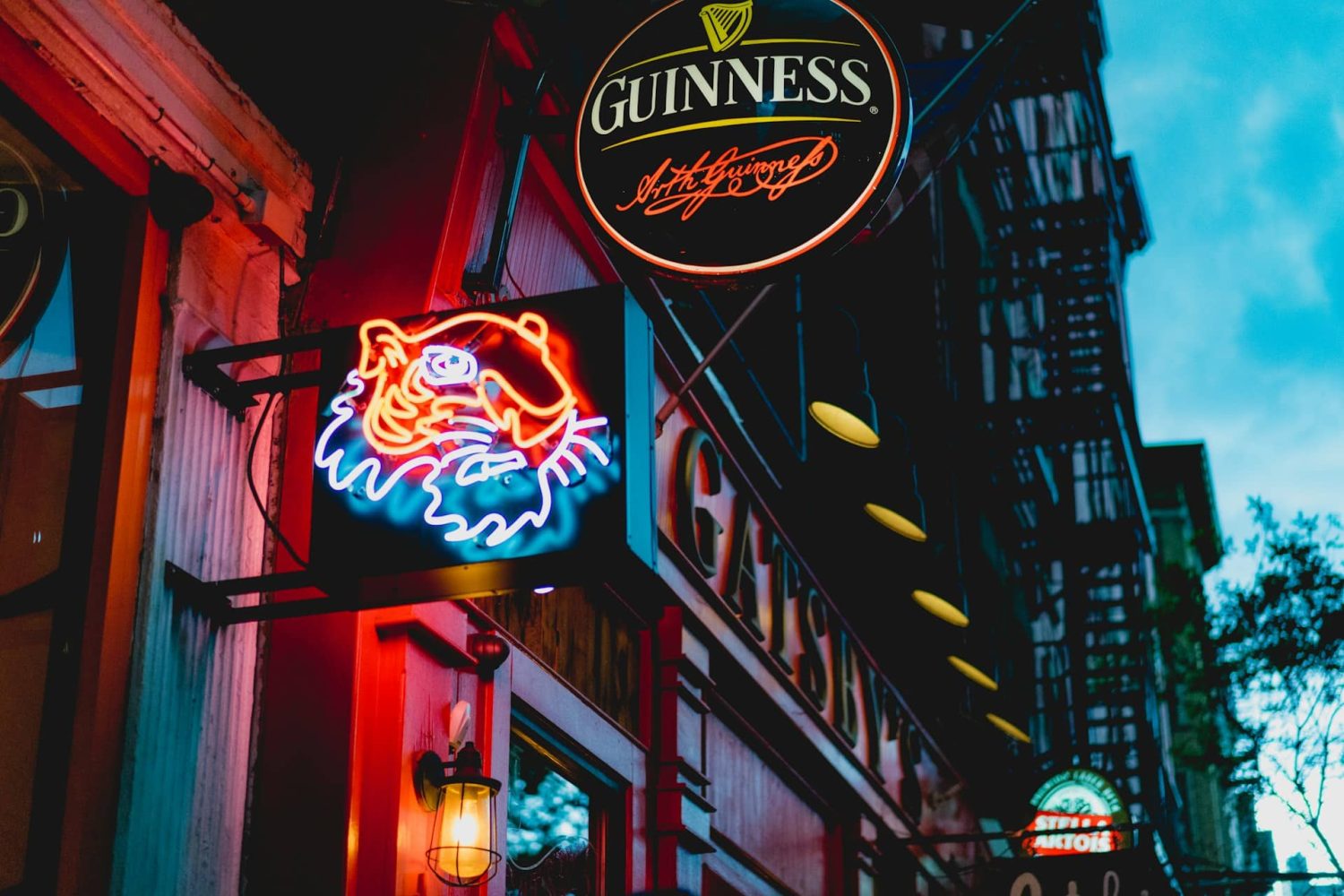 Picture of Irish bar with Guinness sign out front. St. Patrick's Day in New York City.