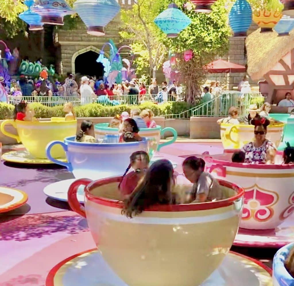Kids love spinning on the tea cups in Disneyland. 