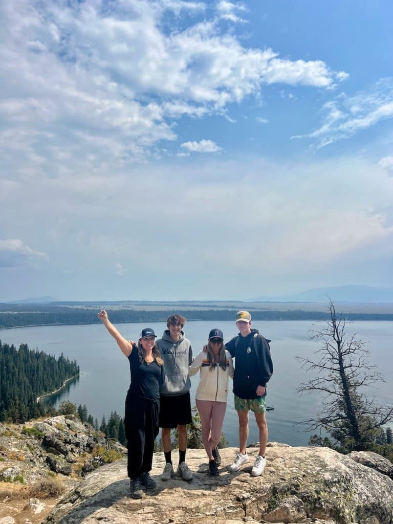 the two families on a montain ridge overlooking lake