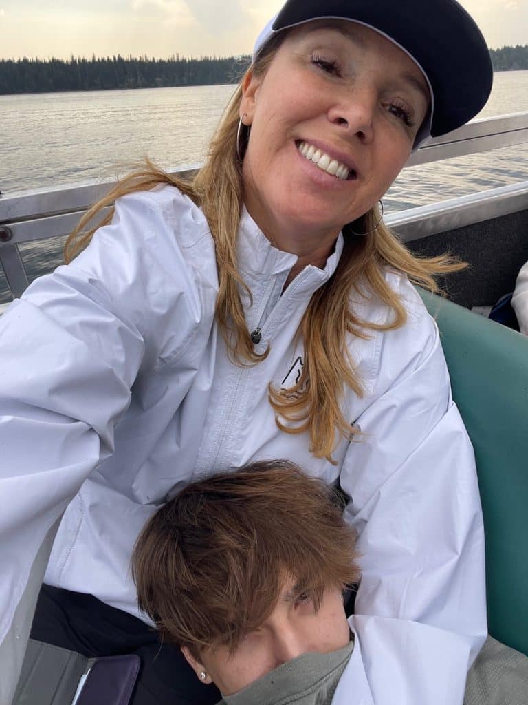 mom with teen son's head in her lap