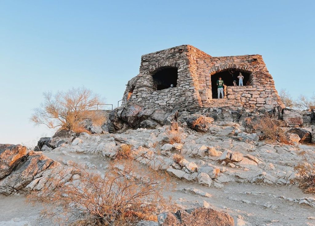 Stone shelter at the top of a mountain.