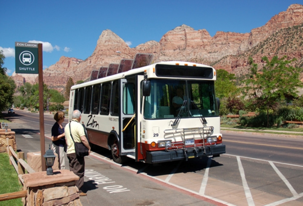 A couple waiting at the bus stop in Zion.