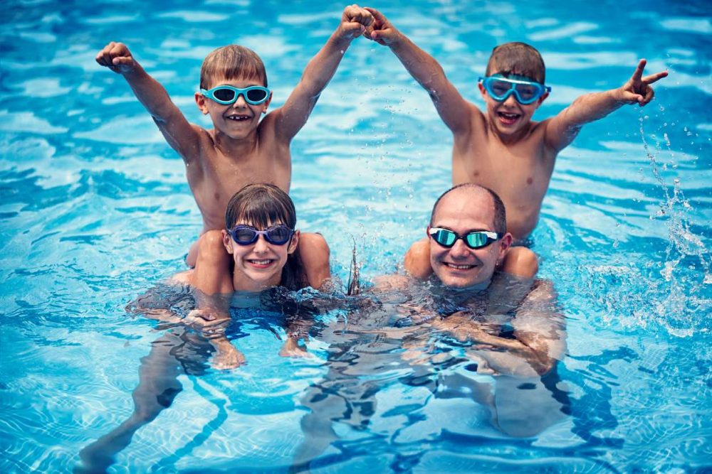family having fun at the indoor pool at Radisson Blu