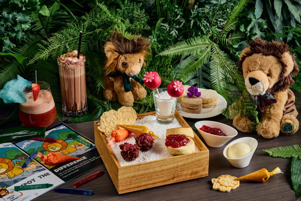 stuffed animals around kid's tea tray