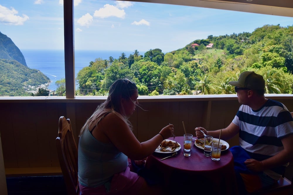 couple eating in restaurant set over pitons