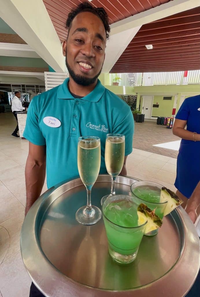 server with drinks on tray