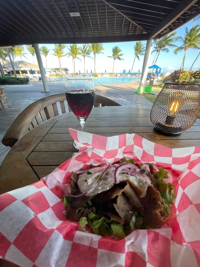 gyro salad with wine poolside