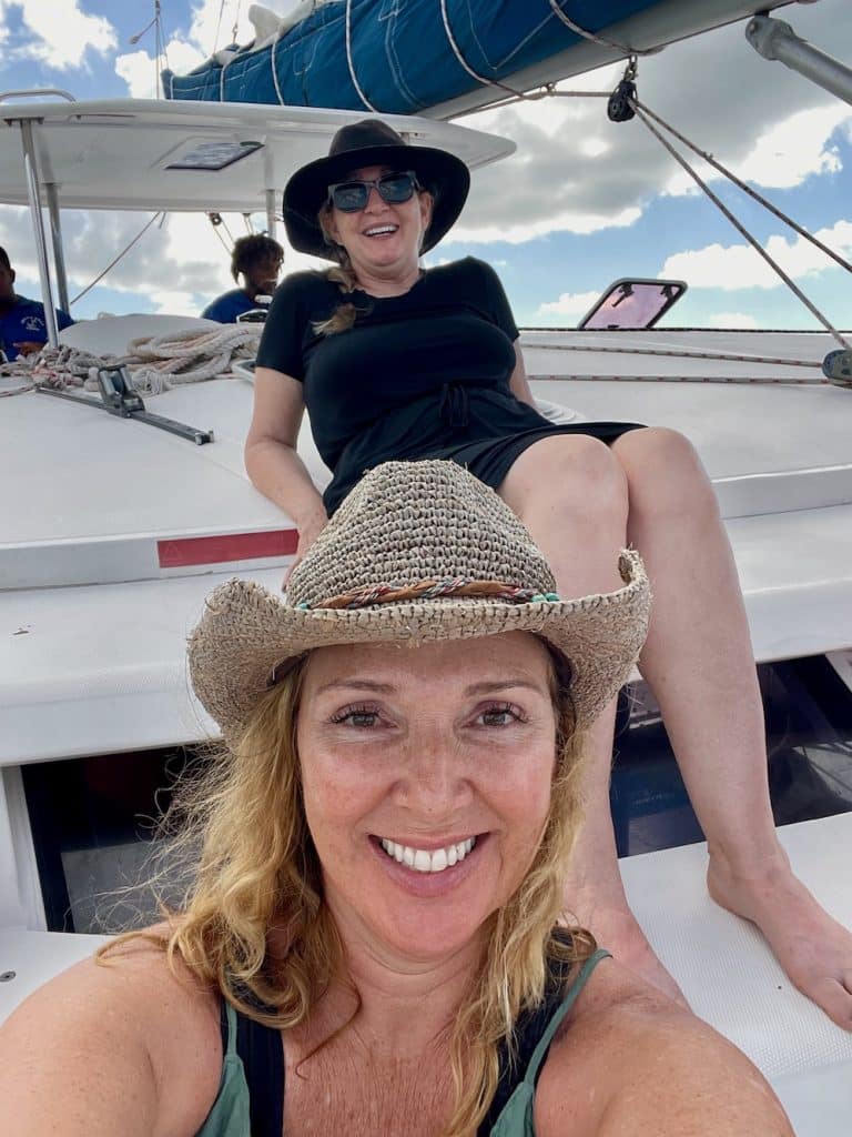 two moms on bow of boat