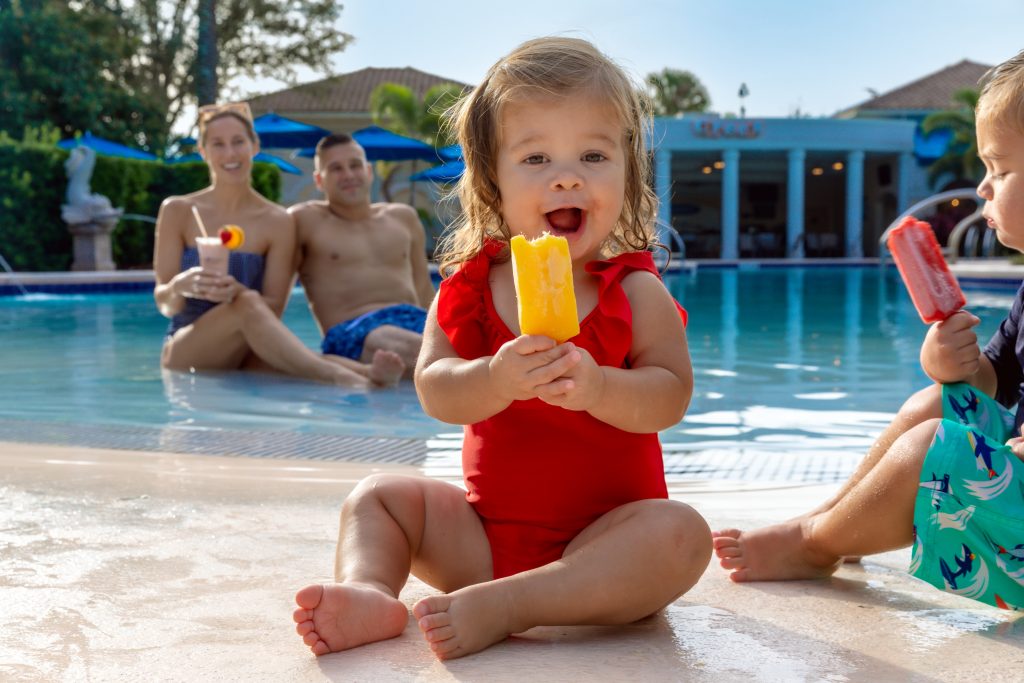toddler girl eating popsicle