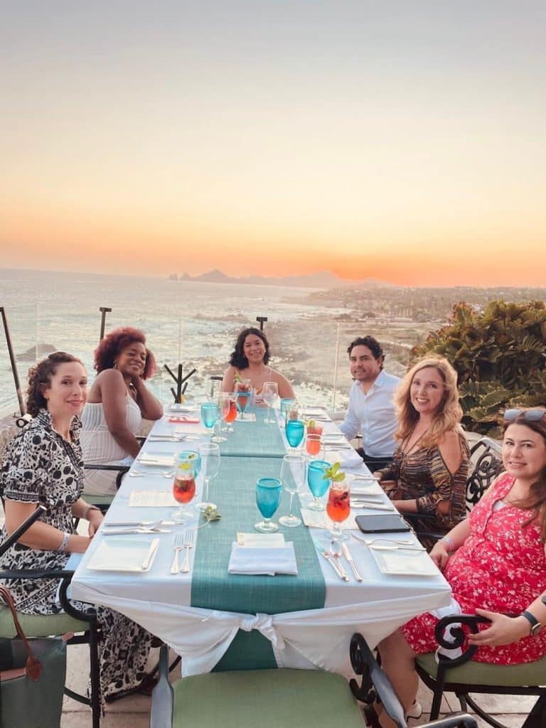 long dining table overlooking ocean