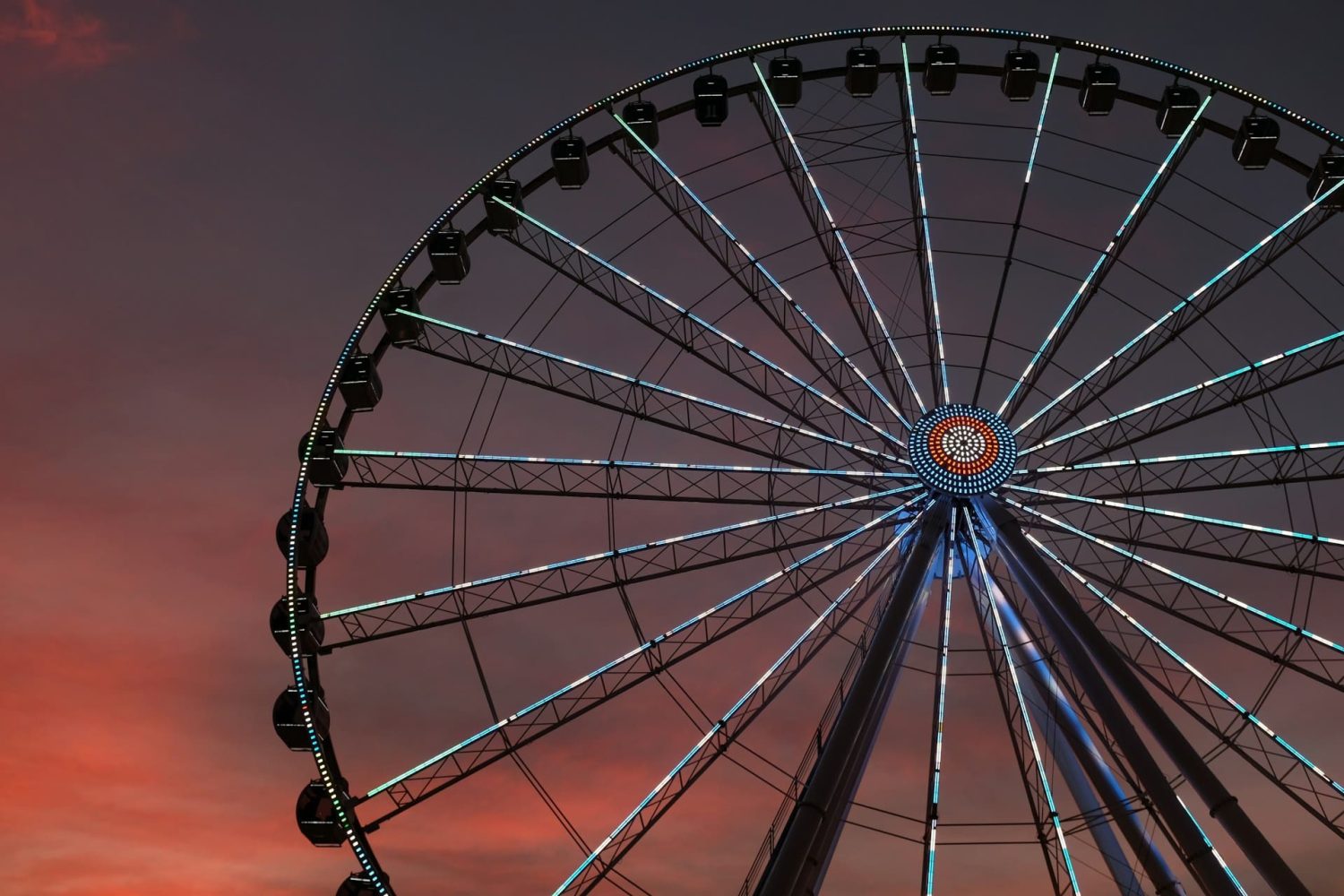 Great Smoky Mountain Wheel with beautiful sunset behind it. Things to do in Pigeon Forge with kids.