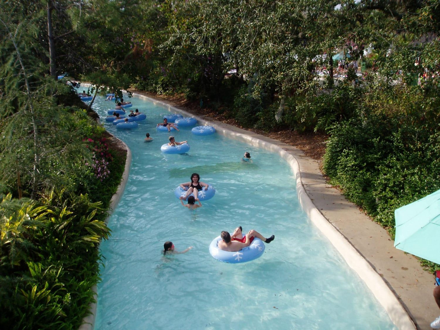 People floating in inner tubes down a lazy river. Cedar Point best rides.