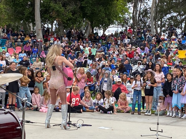 woman performing in front of crowd