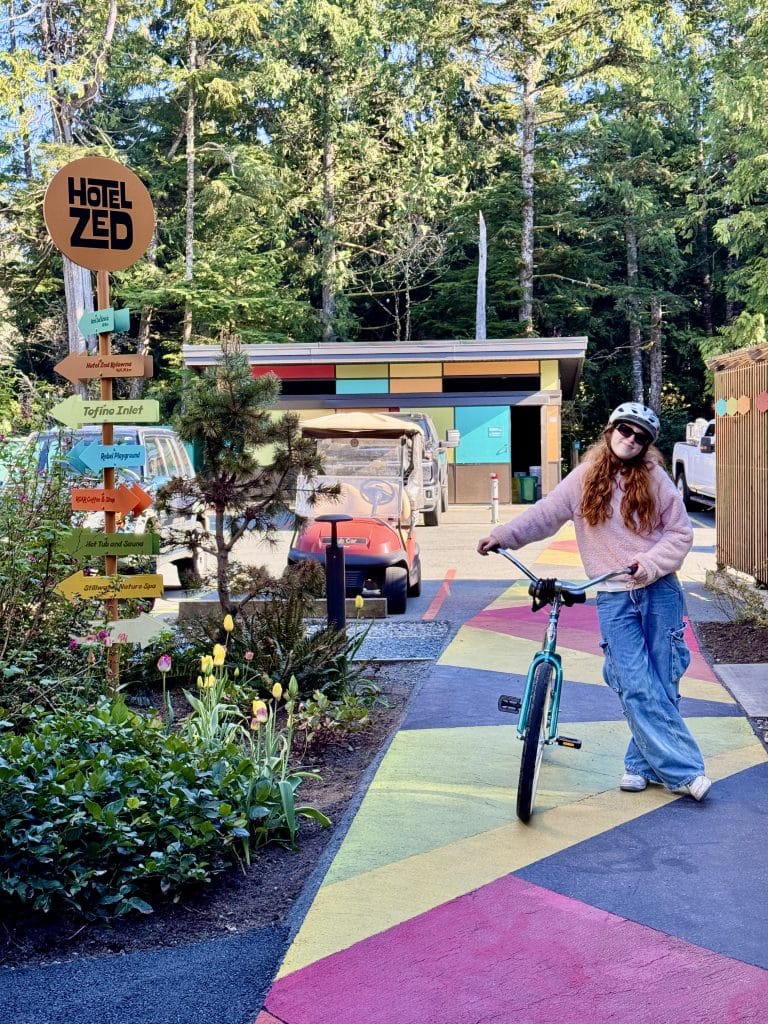 Girl biking in Tofino, BC, Canada
