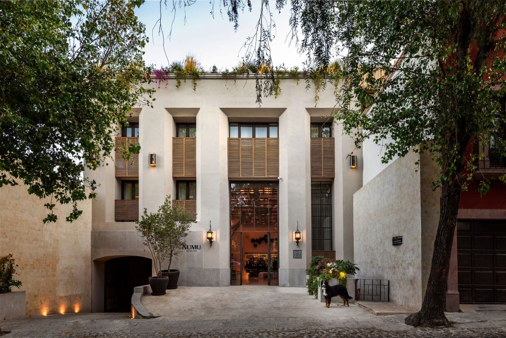 white hotel with wooden highlights