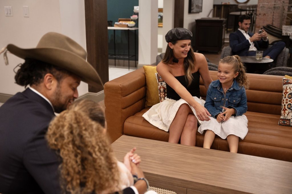 family of four sitting opposite each other in twos