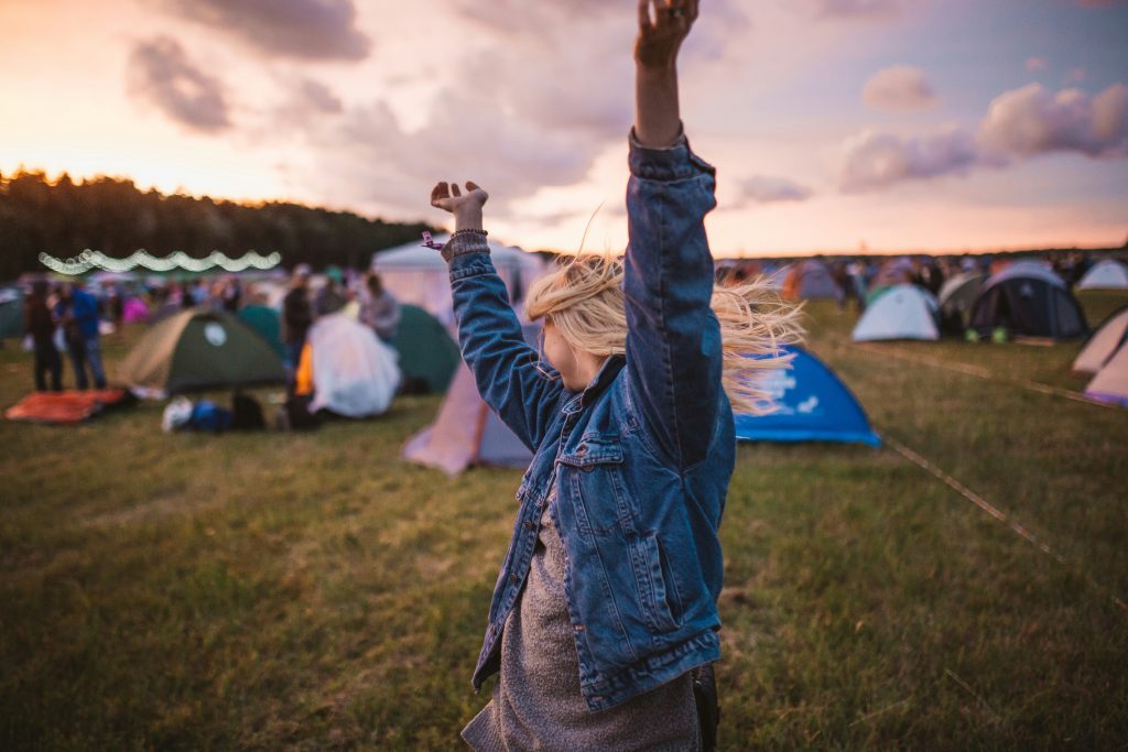 Girl dancing in a field.