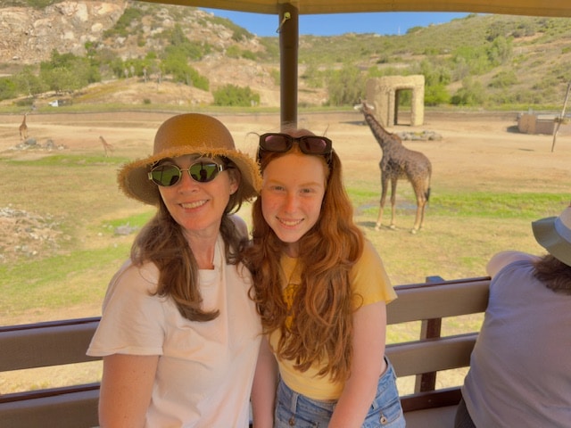 Mom and daughter enjoying some giraffe scenery in San Diego.