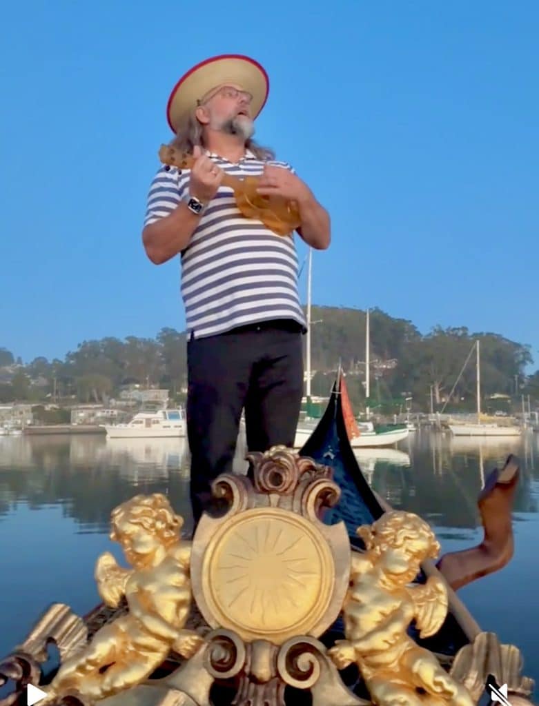 Sunset gondola ride in Morro Bay near the iconic Morro Rock. Gondolier plays ukulele and sings as they glide through calm harbor waters, capturing a peaceful and magical evening on the Central Coast.