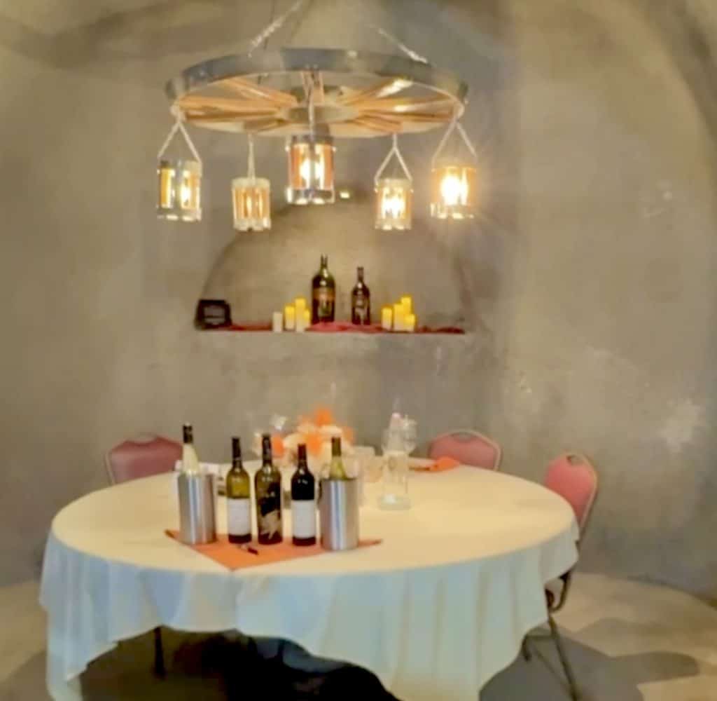 Exploring hand-carved wine caves at the winery. Kids wander through cool, underground passageways while adults enjoy award-winning wines on the sunny patio above. 