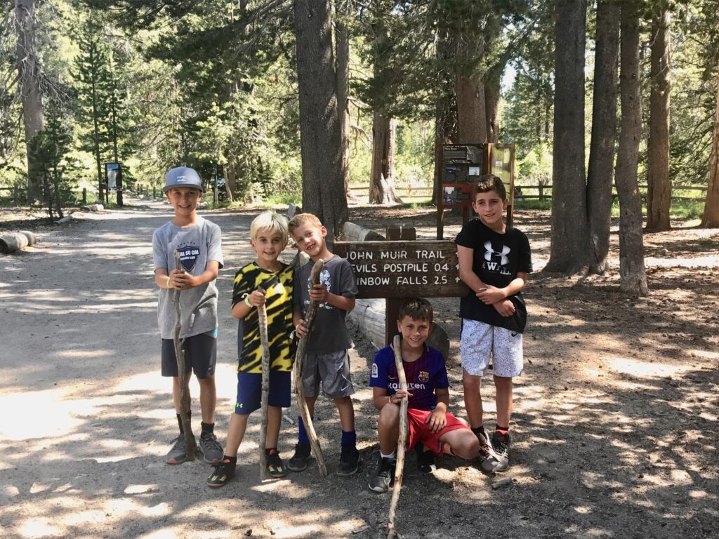 boys by trailhead sign