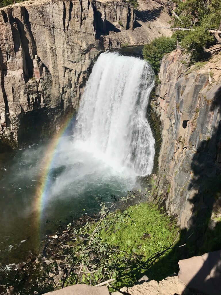 rainbow on bottom of waterfall