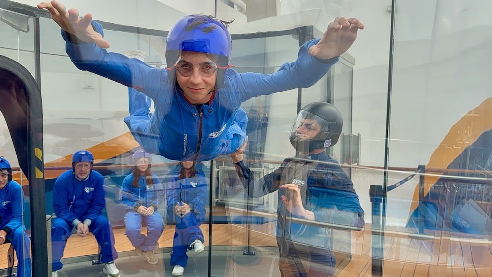 Teen boy flying in tube