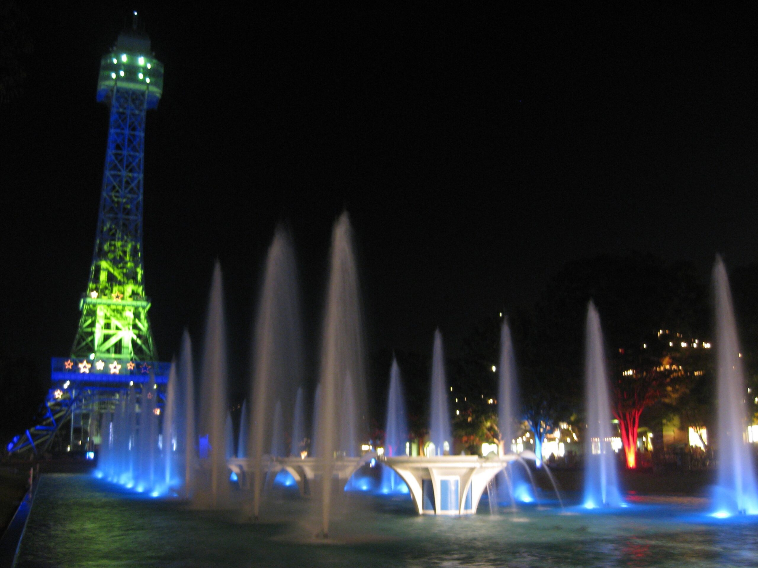 Kings Island A Real Family Guide Eiffel Tower at night with fountains.