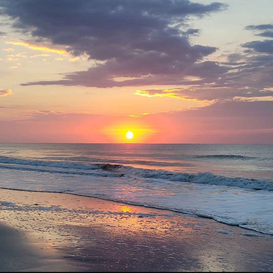 View of sunrise at Myrtle Beach. Oceanfront resorts in Myrtle Beach for families. 