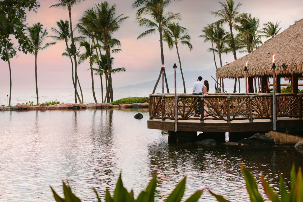 couple standing on floating deck over water