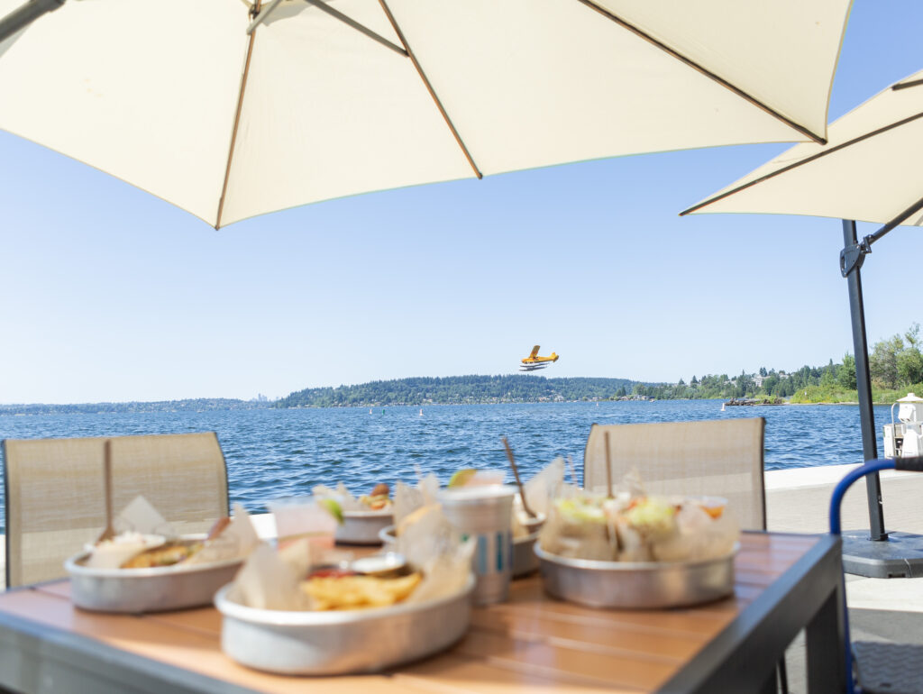 lunch by lake and seaplane in sky