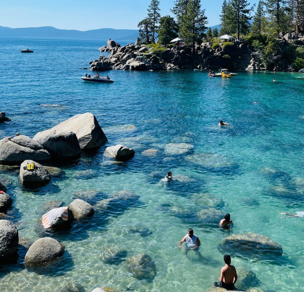 People swimming in Lake Tahoe on a summer day. California Boating Lakes
